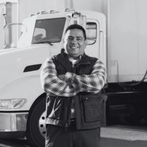 Supplier standing in front of his truck